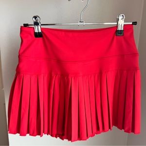 Gold hinge skirt, size red, never worn